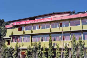 IAM campus building under blue sky, representing one of the best colleges for hotel management with modern facilities.